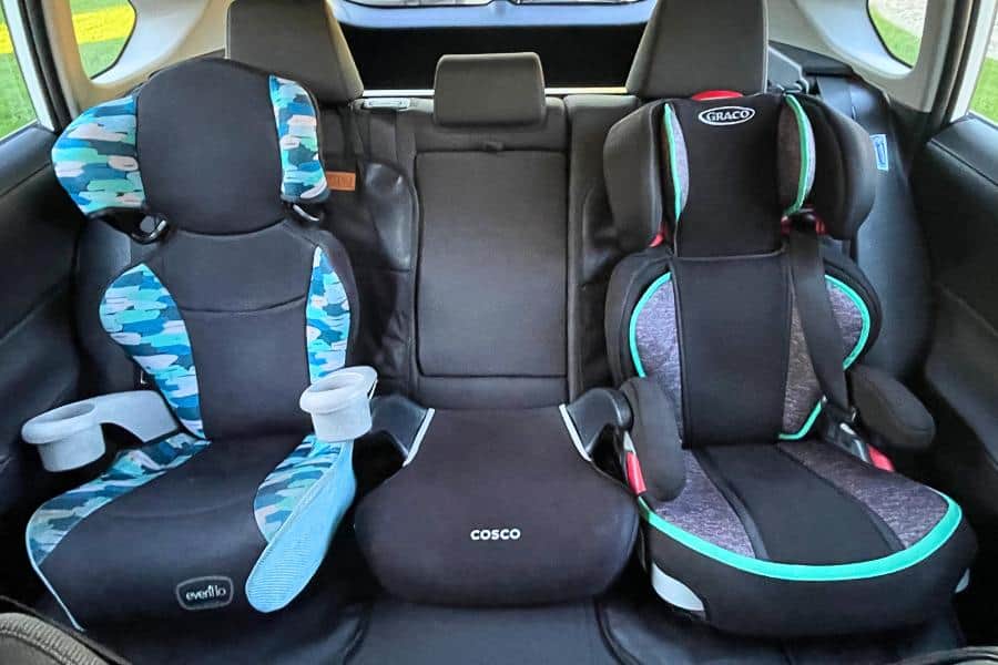 two car seats and a booster in the backseat of a RAV4